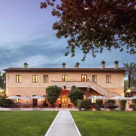 Qc Termeroma Spa And Resort Fiumicino Esterno foto The main building of the hotel